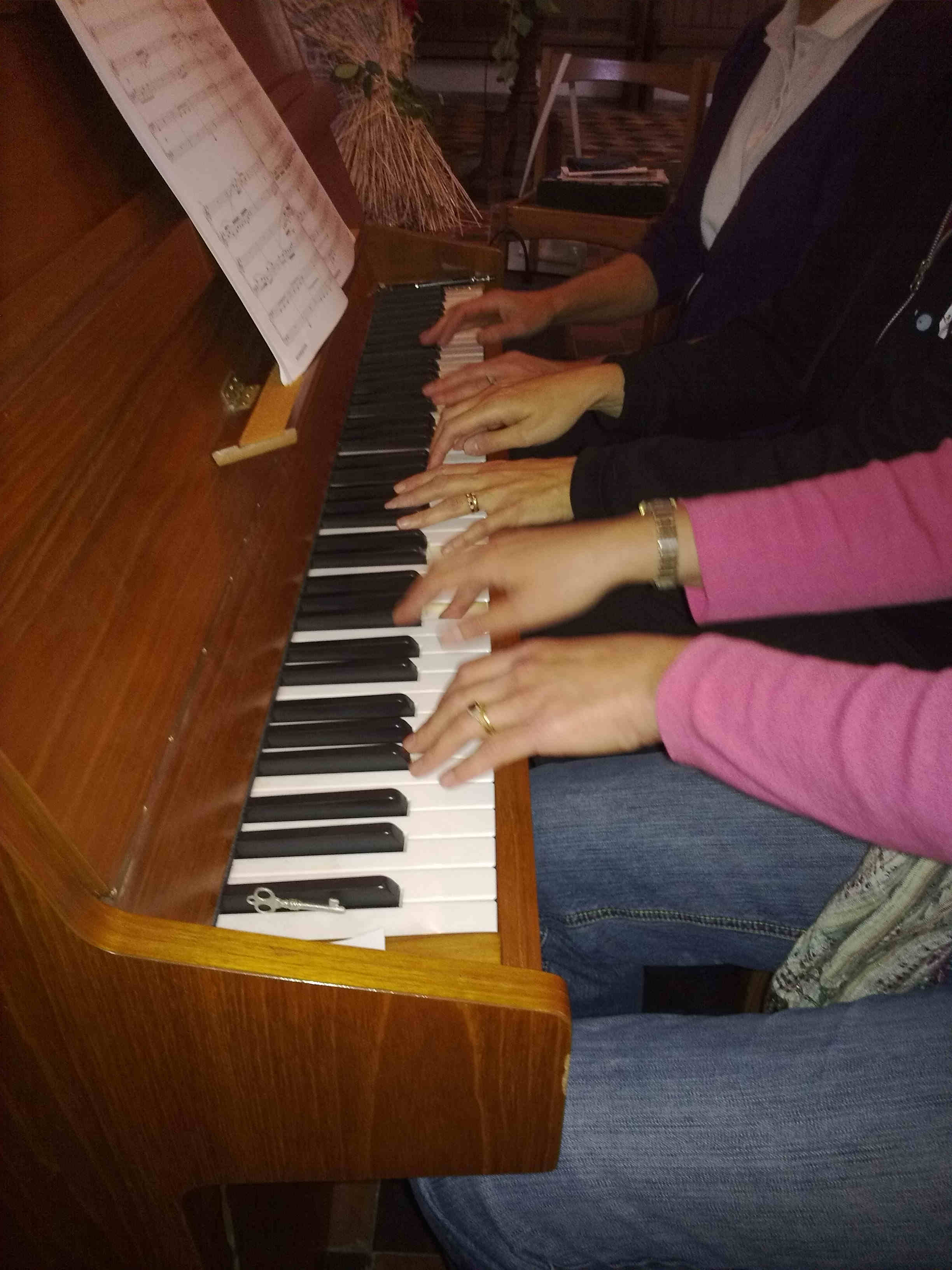 3 pairs of hands; 1 keyboard